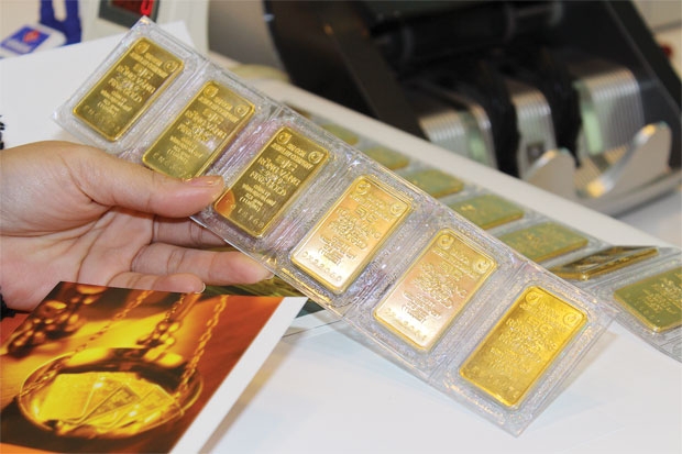 Giá vàng giảm hơn 120,000 đồng, tỷ giá trung tâm tăng 14 đồng