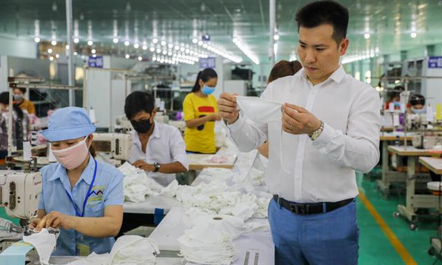 Mask exports offer pandemic-hit Vietnam garment makers breathing space