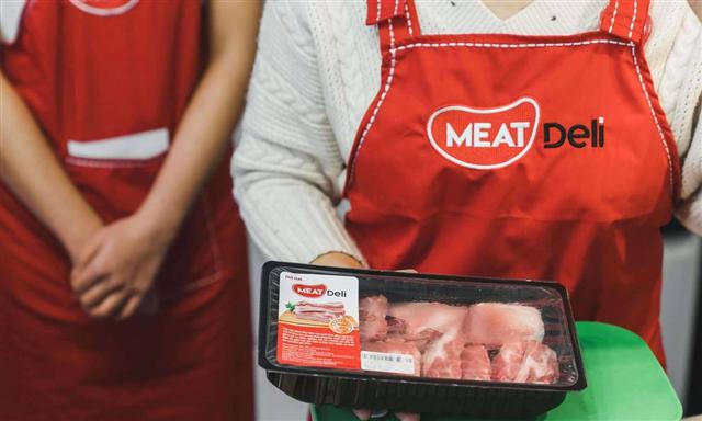 Pork producer issues bonds to raise $87 mln