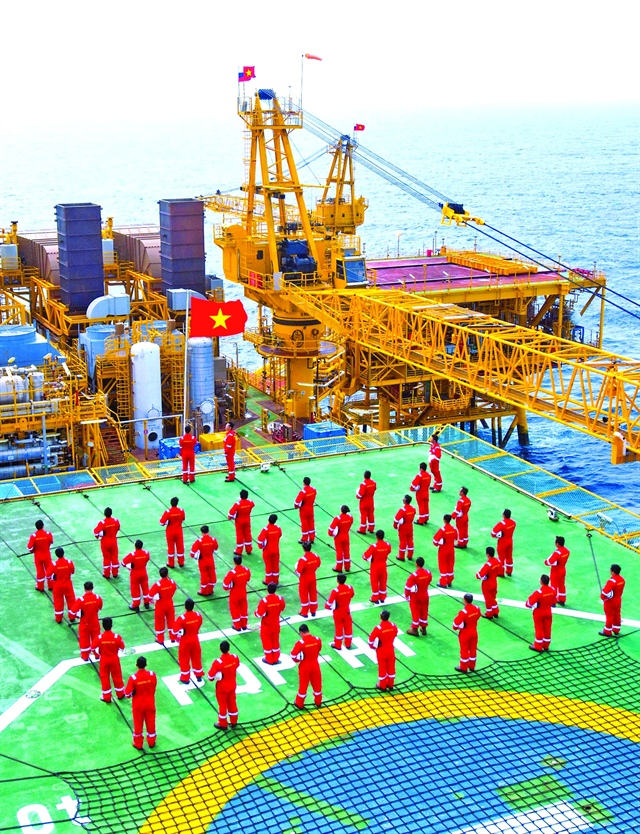 Flag salute ceremony at frontline gas field