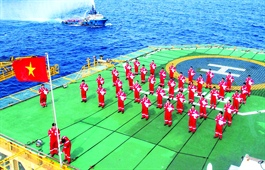 Flag salute ceremony at frontline gas field