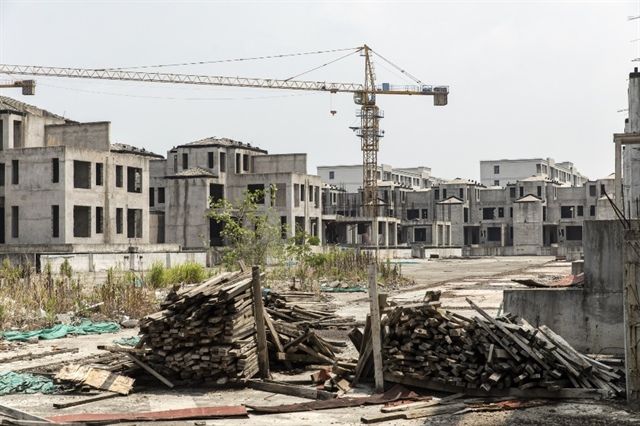 Doanh nghiệp bất động sản Trung Quốc đối mặt kiện tụng yêu cầu bán tài sản để trả nợ