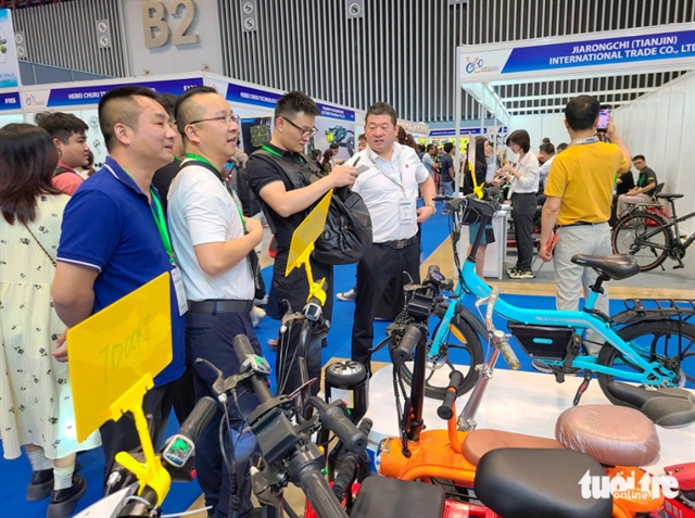 A booth showcasing bikes attracts visitors. Photo: Nhat Xuan / Tuoi Tre