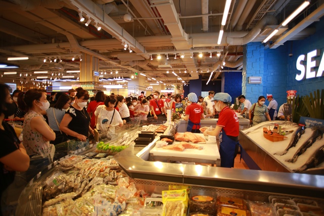 People shop for seafood at a WinMart supermarket. Photo: Supplied