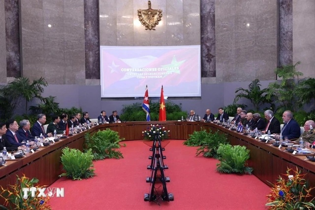 First Secretary of the Communist Party of Cuba Central Committee and President of Cuba Miguel Diaz-Canel Bermudez (R) speaks at the talks with Vietnamese Party General Secretary and State President To Lam in Havana on September 26, 2024. Photo: Vietnam News Agency