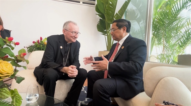 Vietnamese Prime Minister Pham Minh Chinh (R) holds talks to UAE Minister of State Ahmed Sayegh in Brazil on November 19, 2024. Photo: Doan Bac