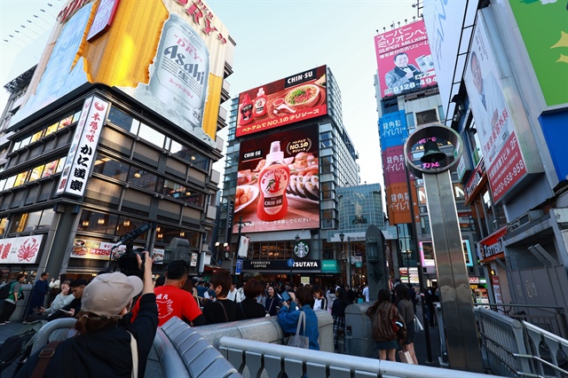 A billboard of CHIN-SU chili sauce in Dotonbori, Osaka