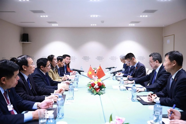 Prime Minister Pham Minh Chinh during a meeting with Permanent Vice Premier of the State Council of China Ding Xuexiang in Davos, Switzerland, on January 21, 2025. Photo: Vietnam Government Portal