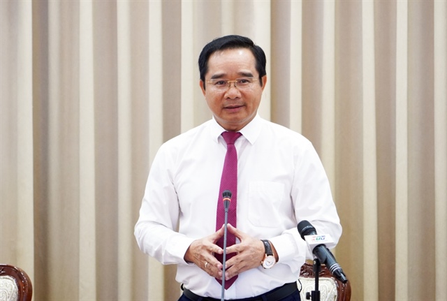 Director of the Ho Chi Minh City Department of Science and Technology Lam Dinh Thang (standing) speaks at the workshop. Photo: Nguyen Anh / Tuoi Tre