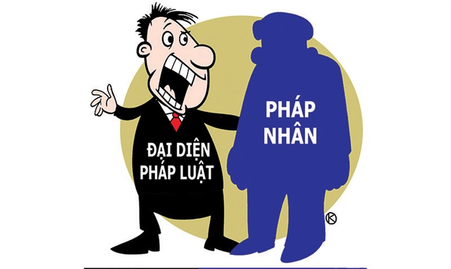 A person standing in front of a blurred background with the words 'Tach Bach Phap Nhan' which translates to 'Separation of Legal Entities' in English.