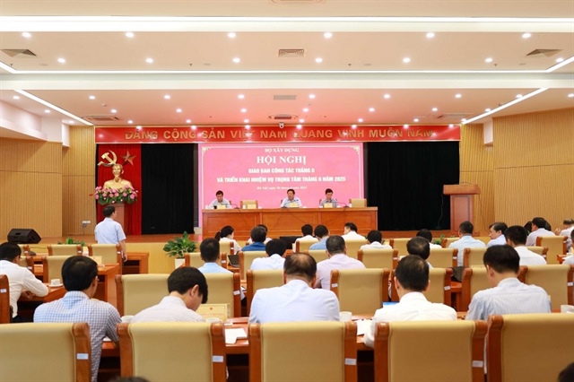 Minister of Construction Tran Hong Minh chaired the meeting. Photo: MoC