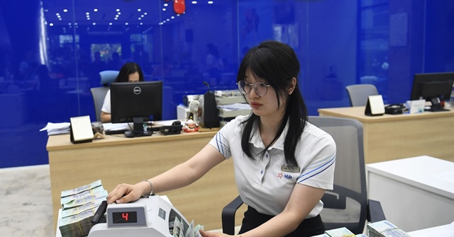 Dòng vốn từ hệ thống ngân hàng sẽ được tập trung vào các lĩnh vực sản xuất kinh doanh. Ảnh: T.L