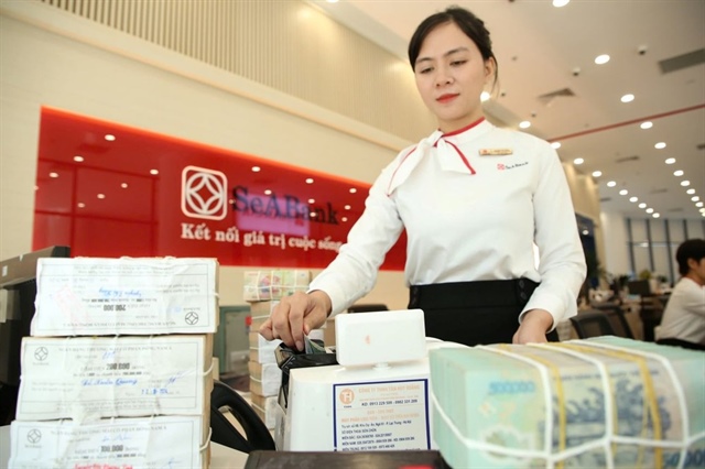 Đồng USD hạ nhiệt, giúp tiền đồng giảm áp lực trong năm 2026. Ảnh: PM