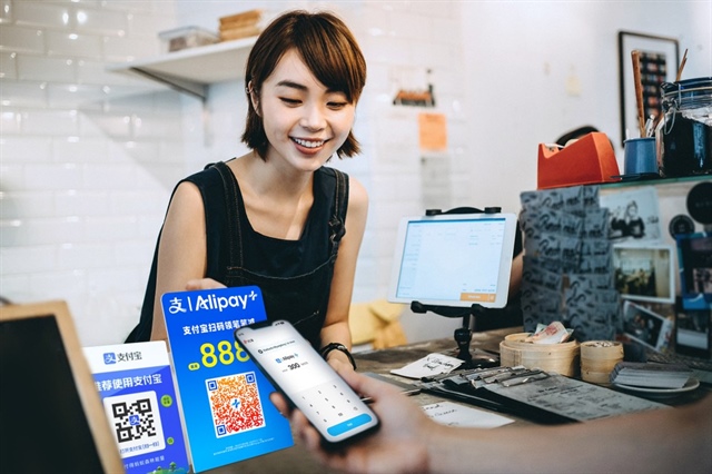 Hạ tầng thanh toán số giúp các hộ kinh doanh nhỏ tiếp cận khách quốc tế thuận tiện hơn. Ảnh minh họa
