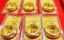 Giá vàng giảm nhẹ, tỷ giá trung tâm tăng phiên thứ 4 liên tiếp